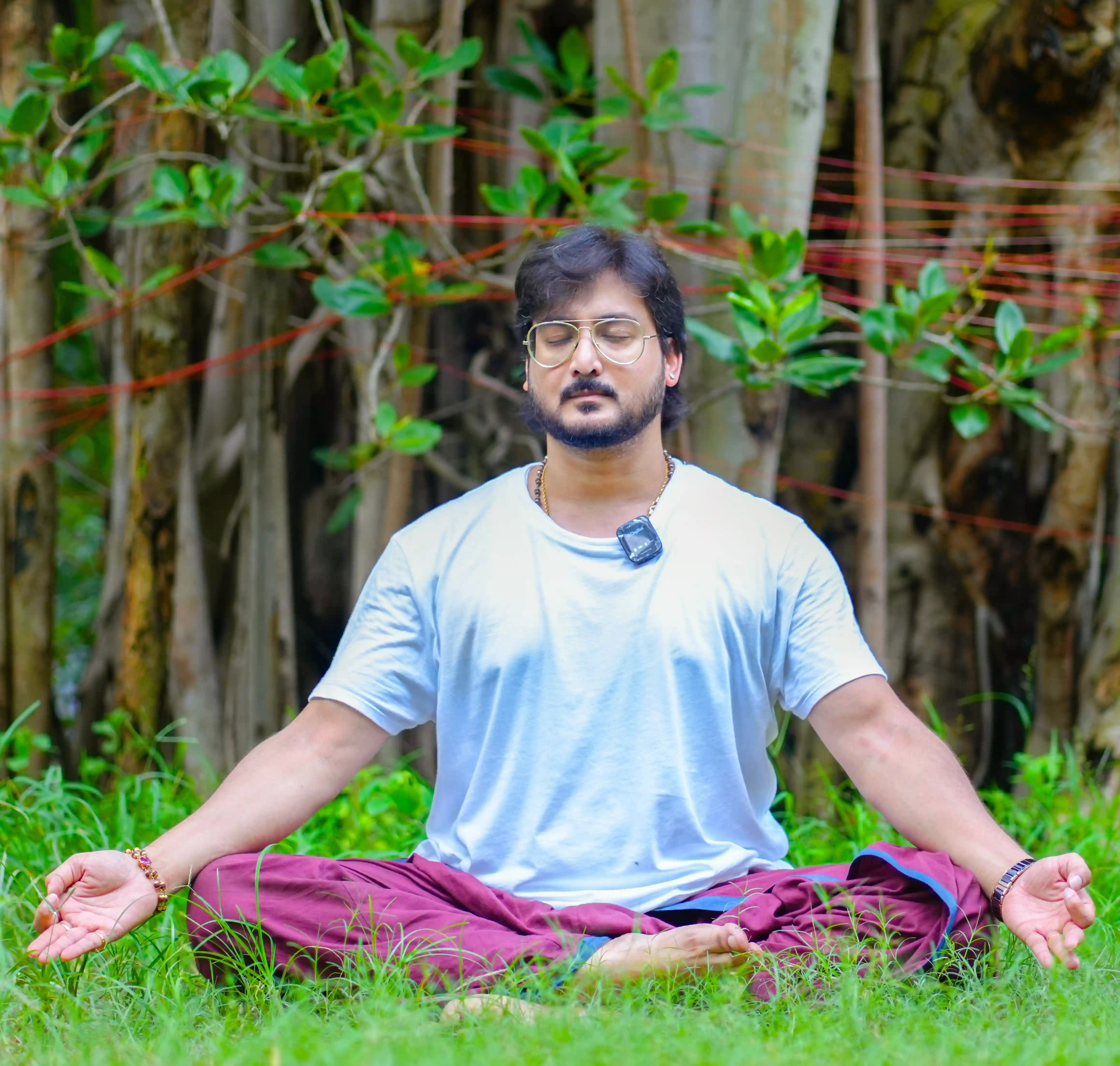 A student experiencing the personal benefits of a yoga and meditation teacher training program, focusing on stress relief and mental clarity.